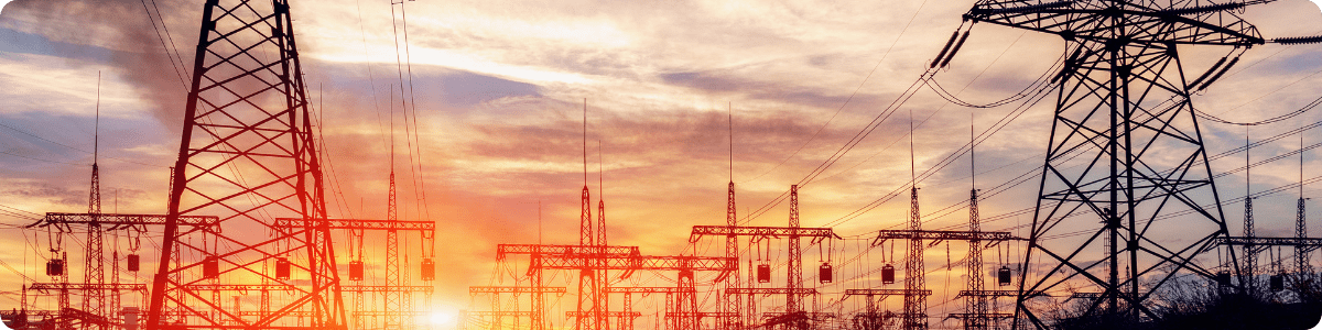 an image of power lines during sunset